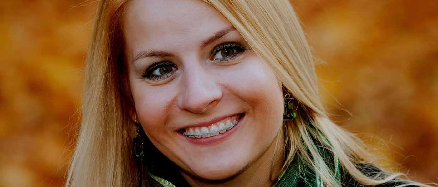 Smiling woman with clear braces