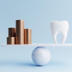 coins and tooth representing cost of Invisalign in Highland Park