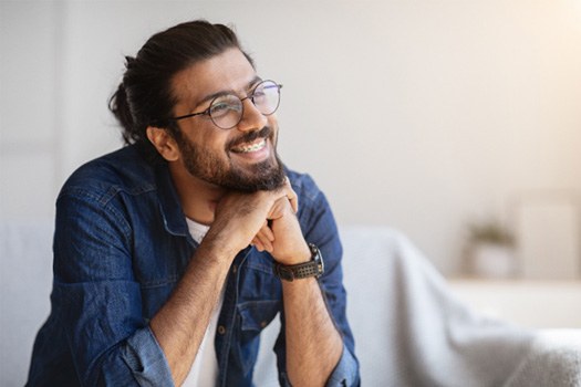 Man smiling with braces