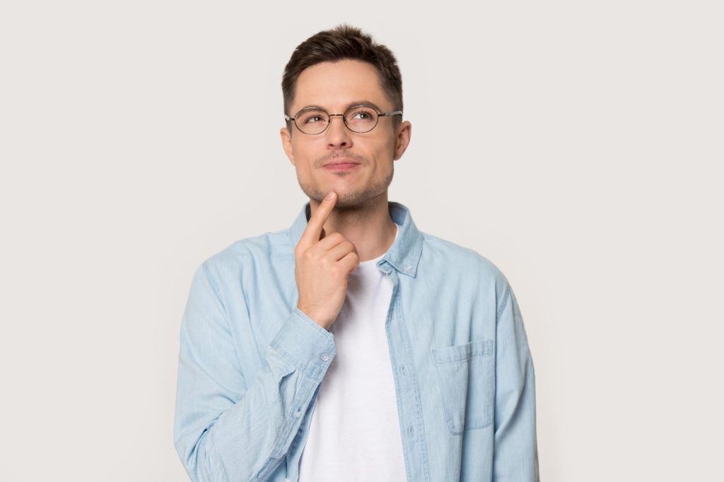 Closeup of man with glasses contemplating