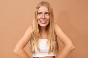 puzzled person with braces