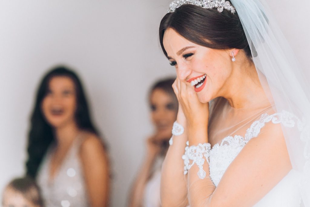 Closeup of bride with white teeth smiling