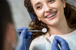 a patient speaking with their orthodontist about braces